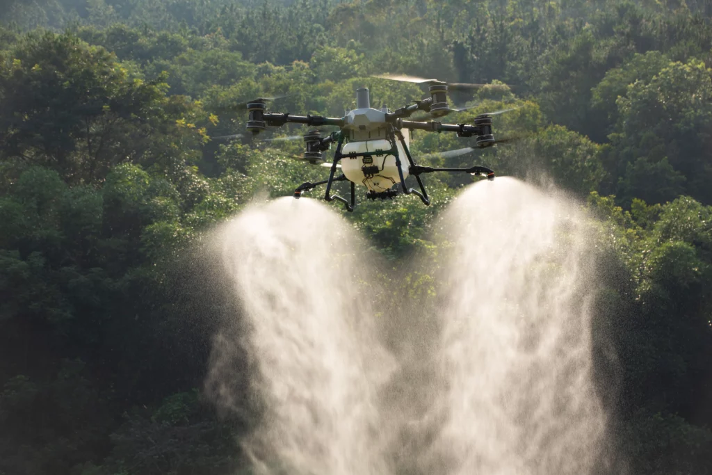 DJI Agras agricultural drone spraying crops